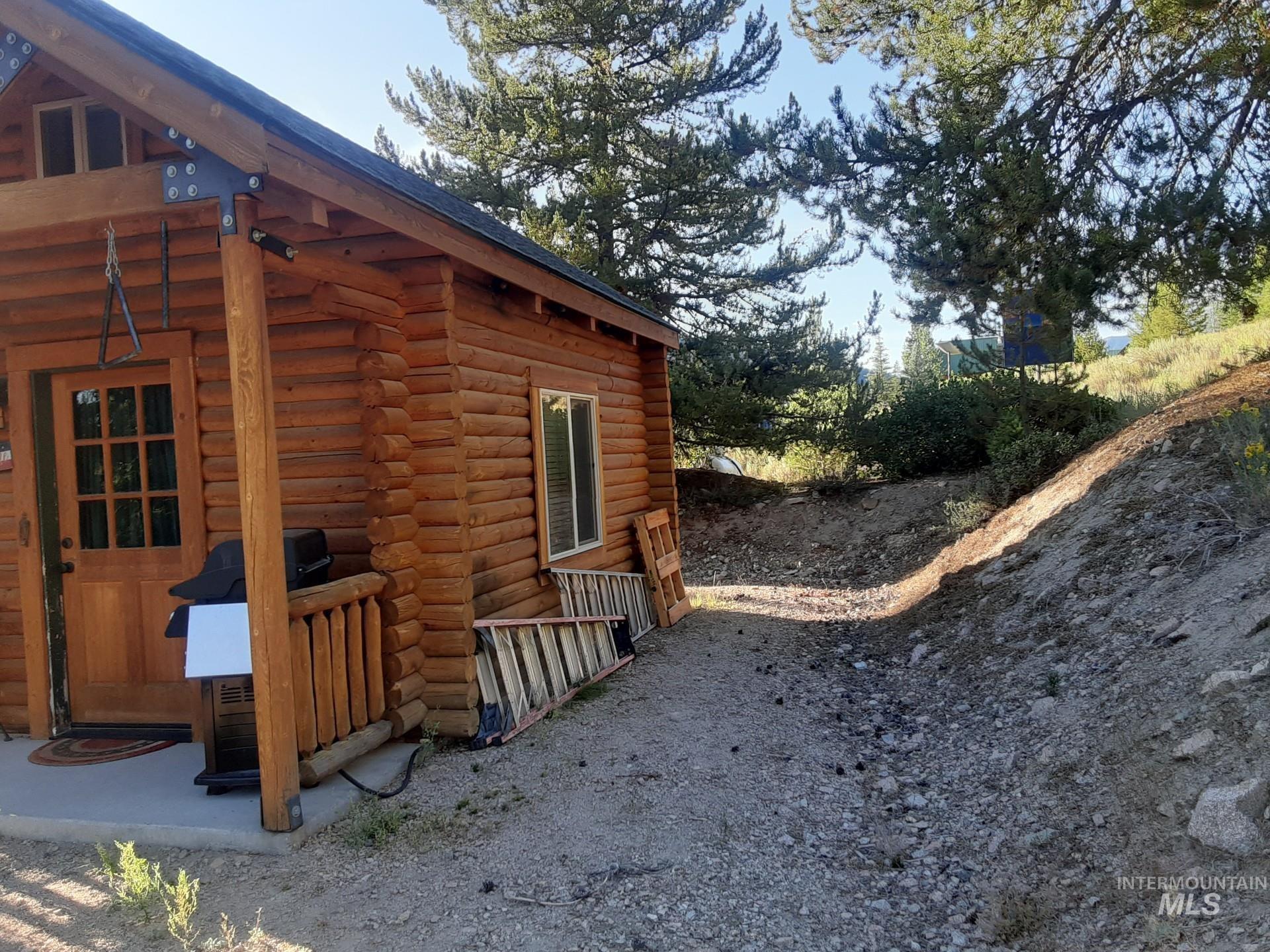 View of property exterior featuring log exterior