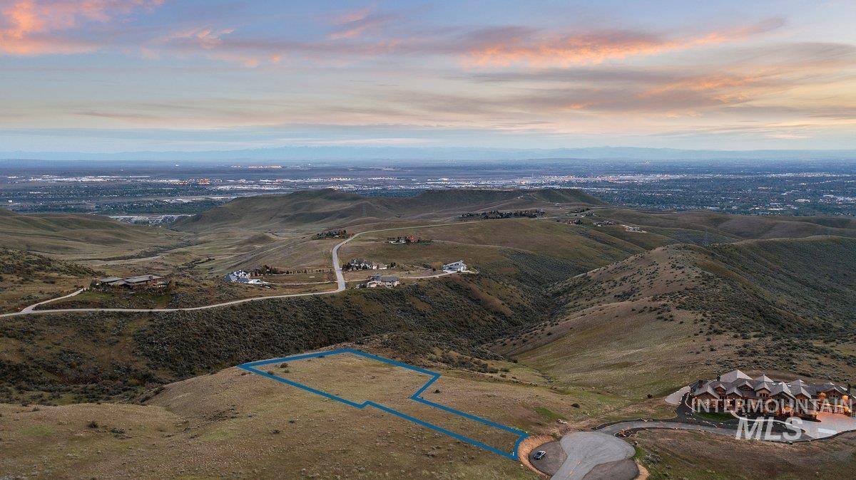 Aerial view of property and surrounding area with property parcel outlined