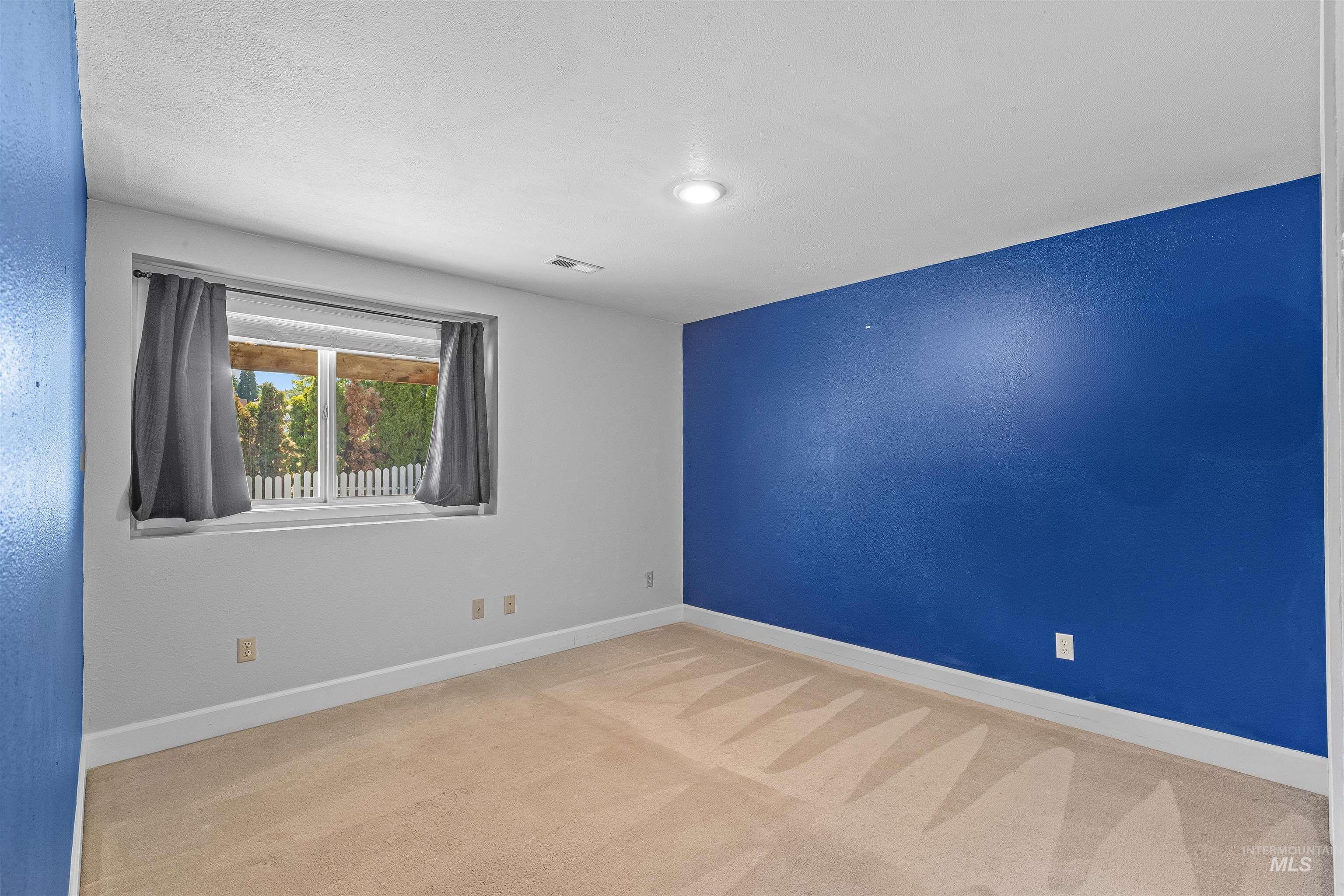 Unfurnished room with carpet floors and recessed lighting