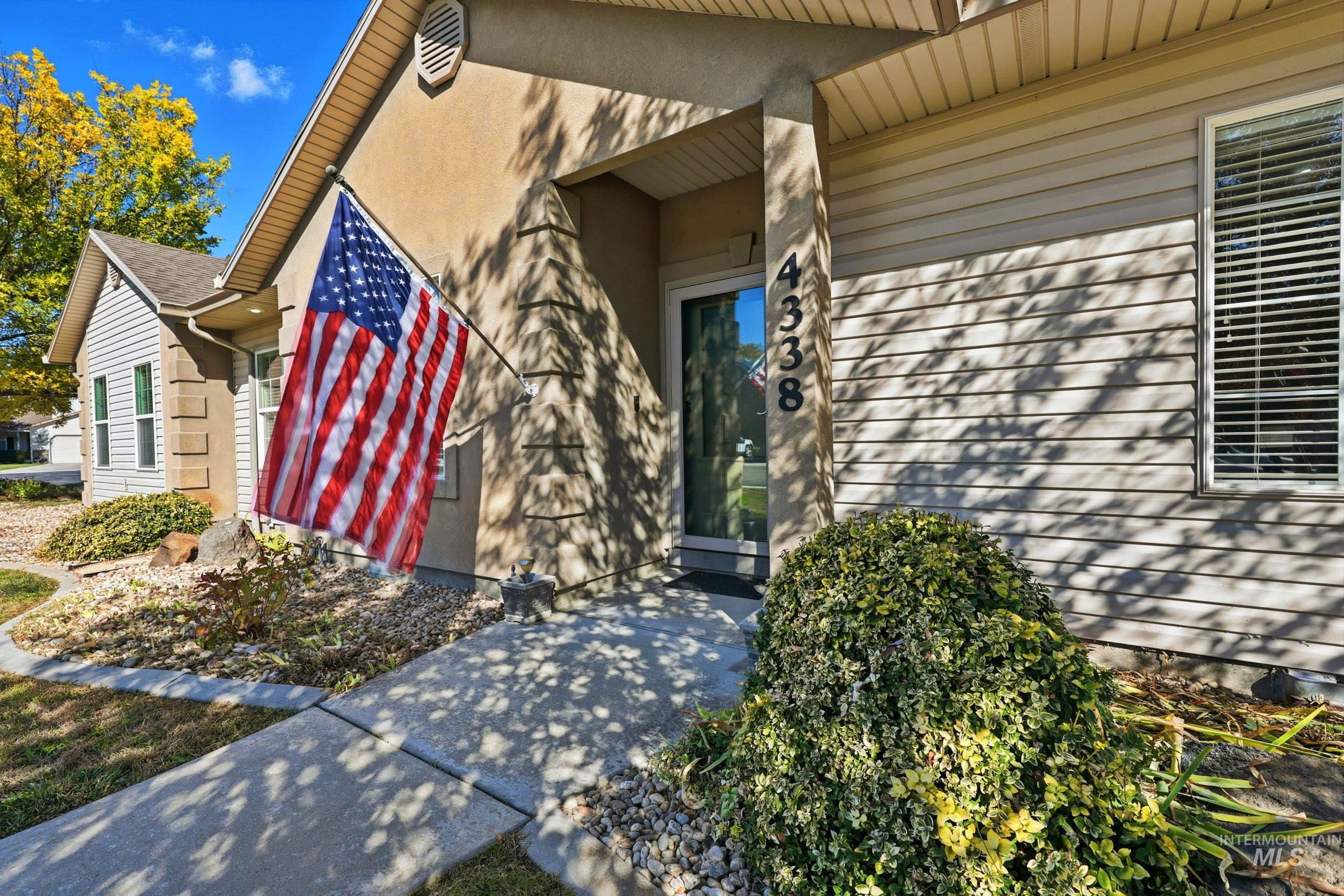 Entrance to property with stucco siding