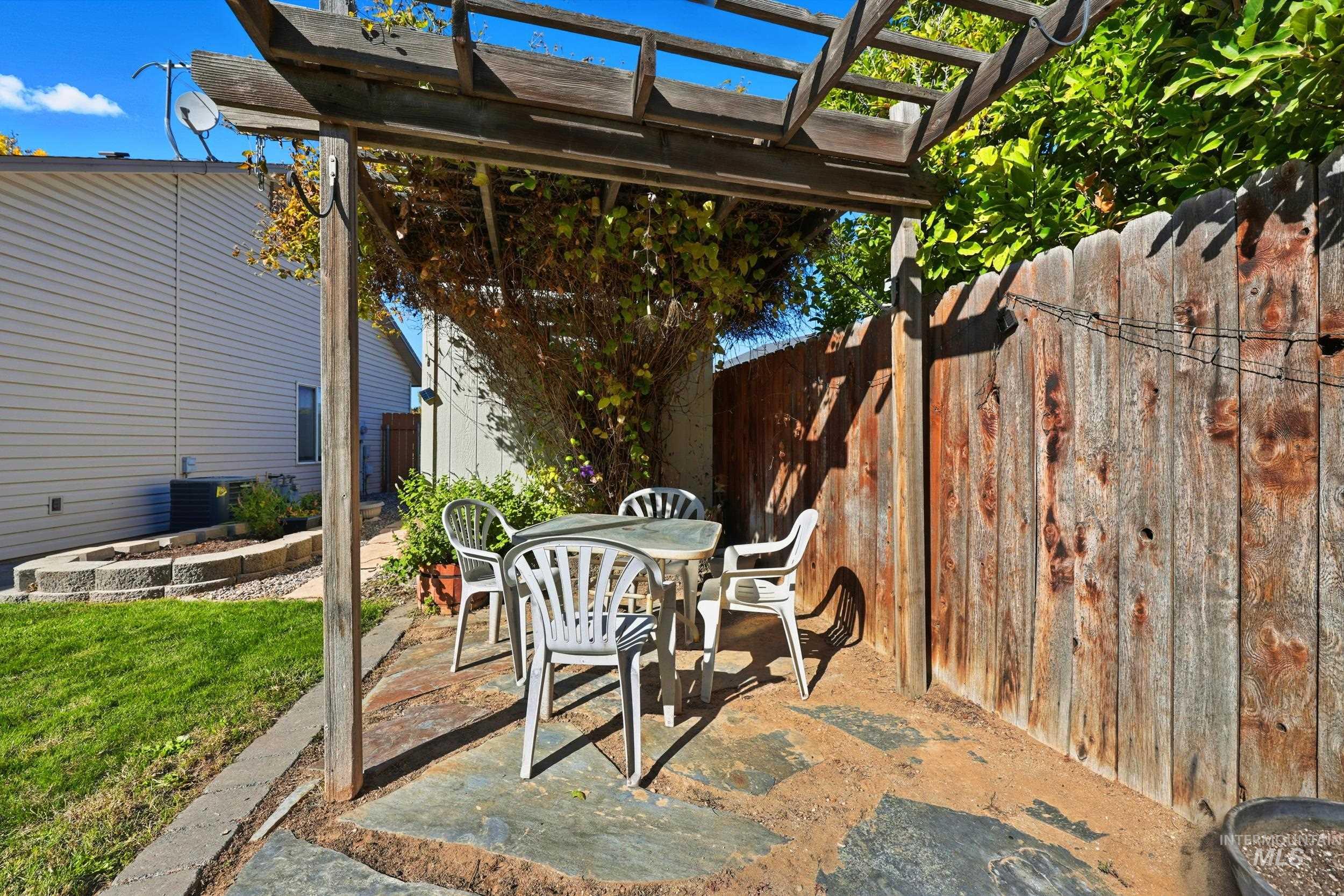 View of patio / terrace featuring a pergola and outdoor dining area