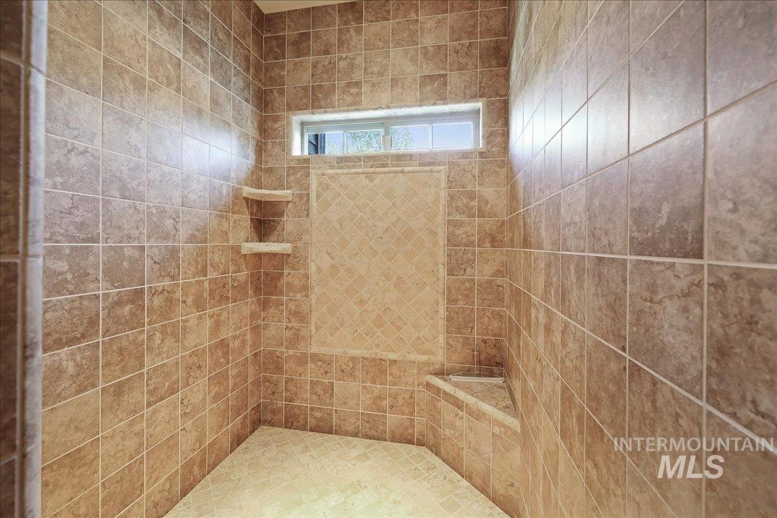 Full bathroom featuring tiled shower