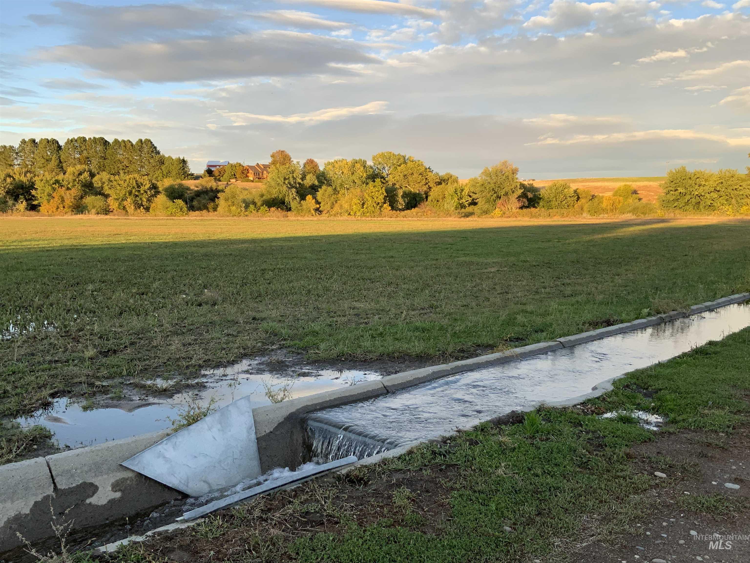 View of green lawn featuring a rural view