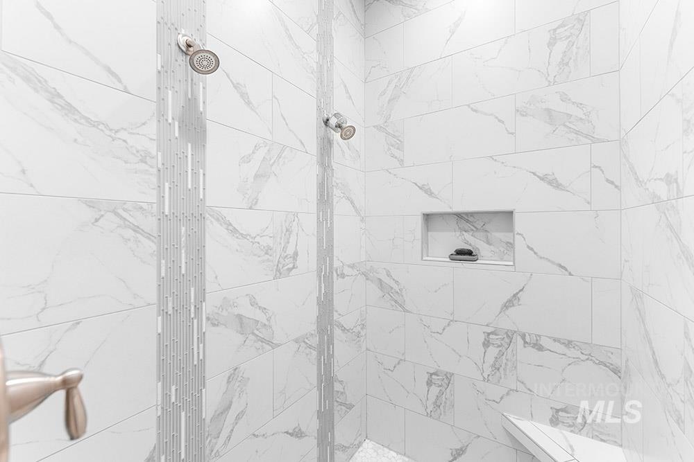 Full bathroom featuring a stall shower