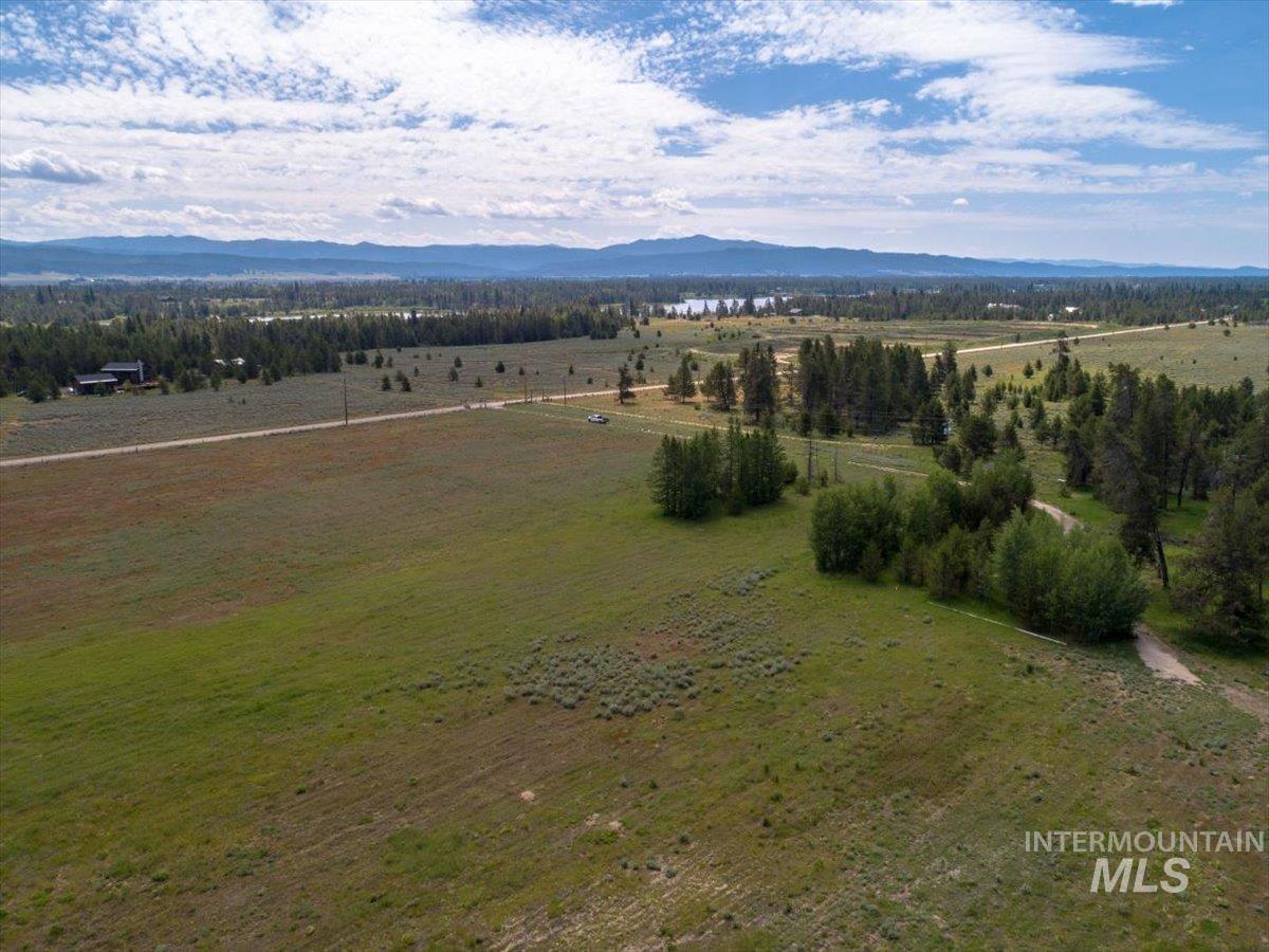 Aerial view of sparsely populated area with a mountain backdrop