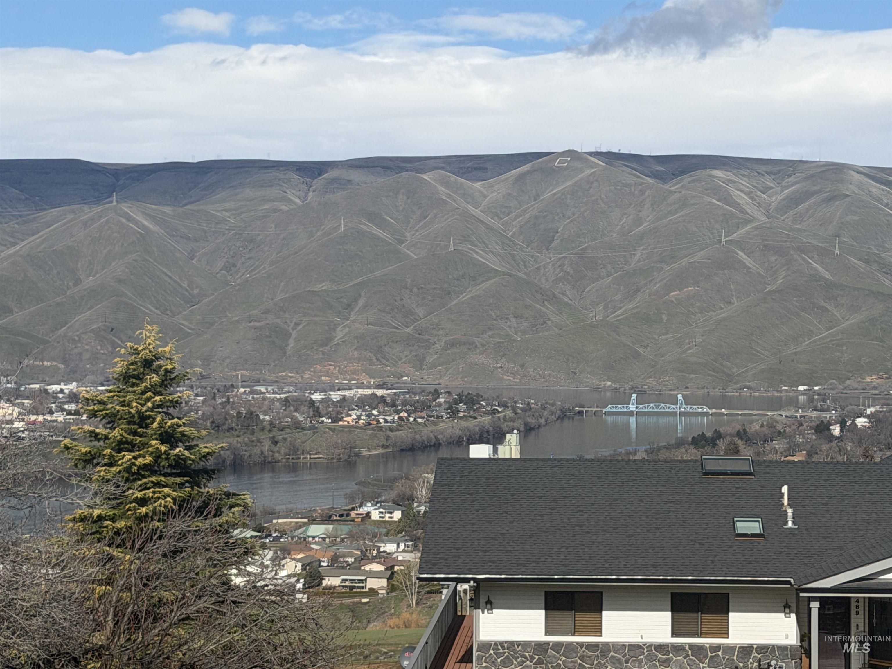 Mountain view featuring a large body of water