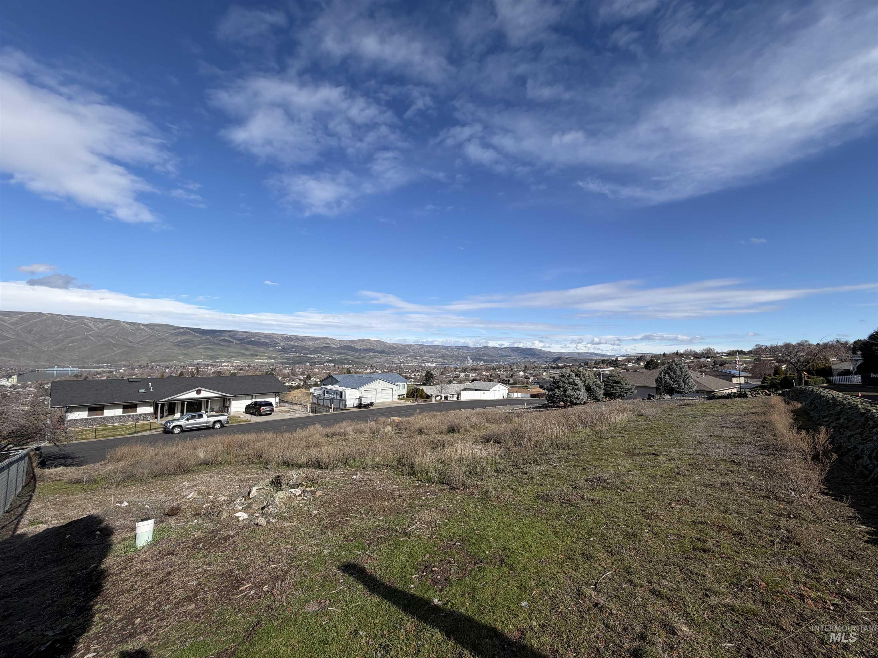 View of mountain backdrop with nearby suburban area