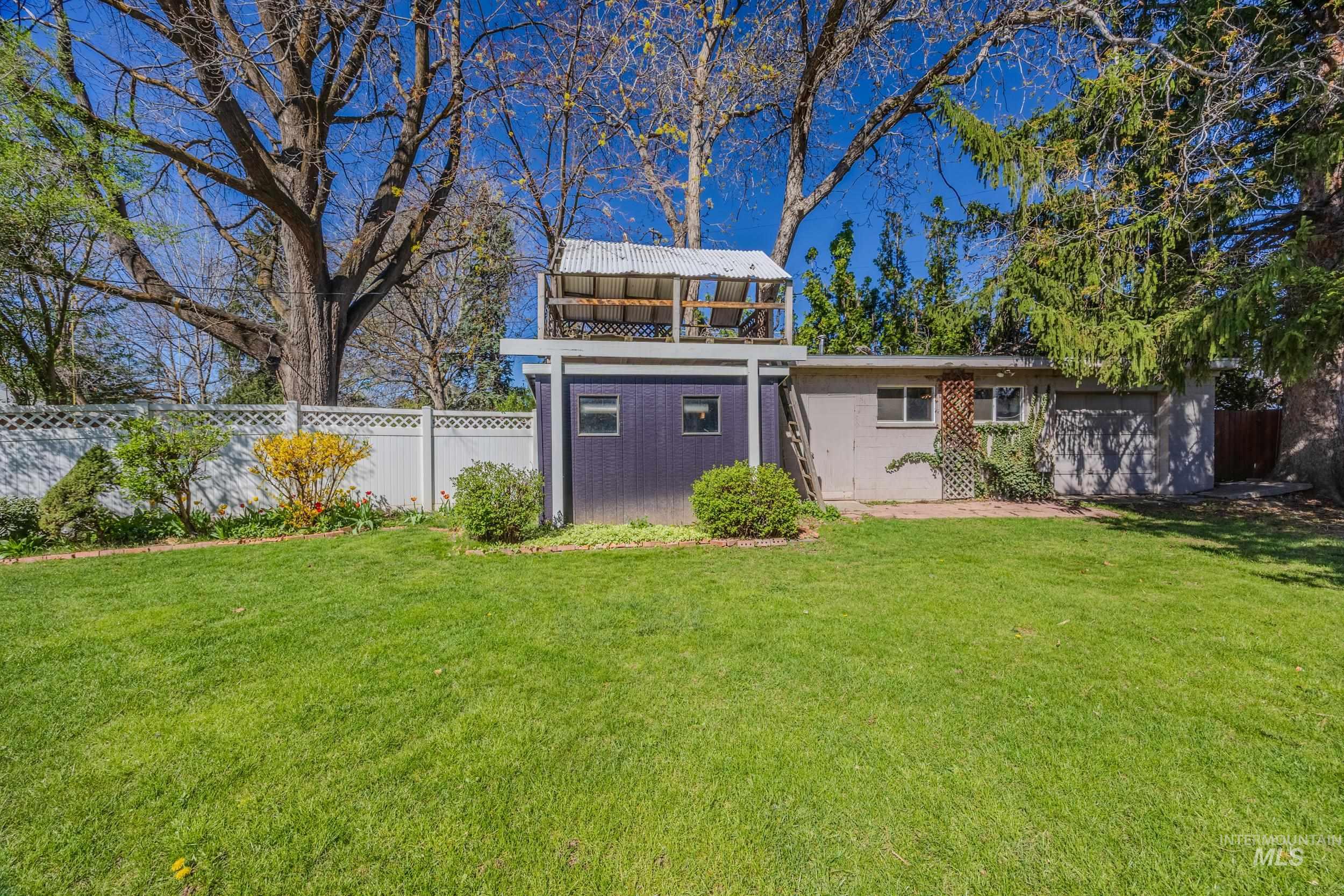 View of outbuilding featuring a fenced backyard