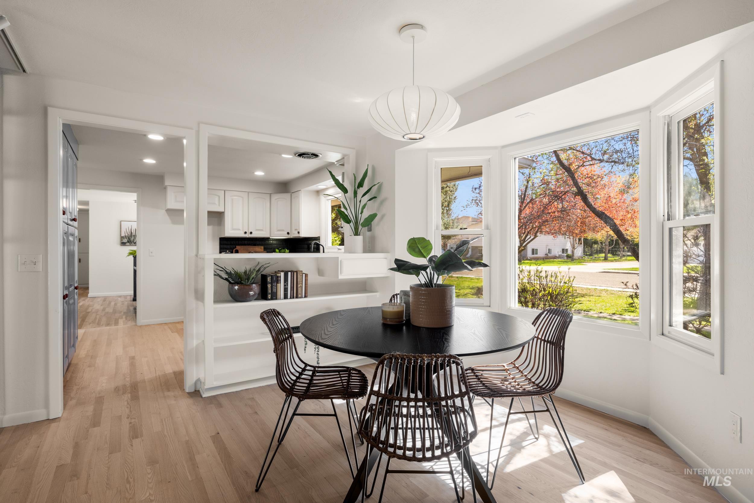 Dining space featuring light wood-style floors and recessed lighting