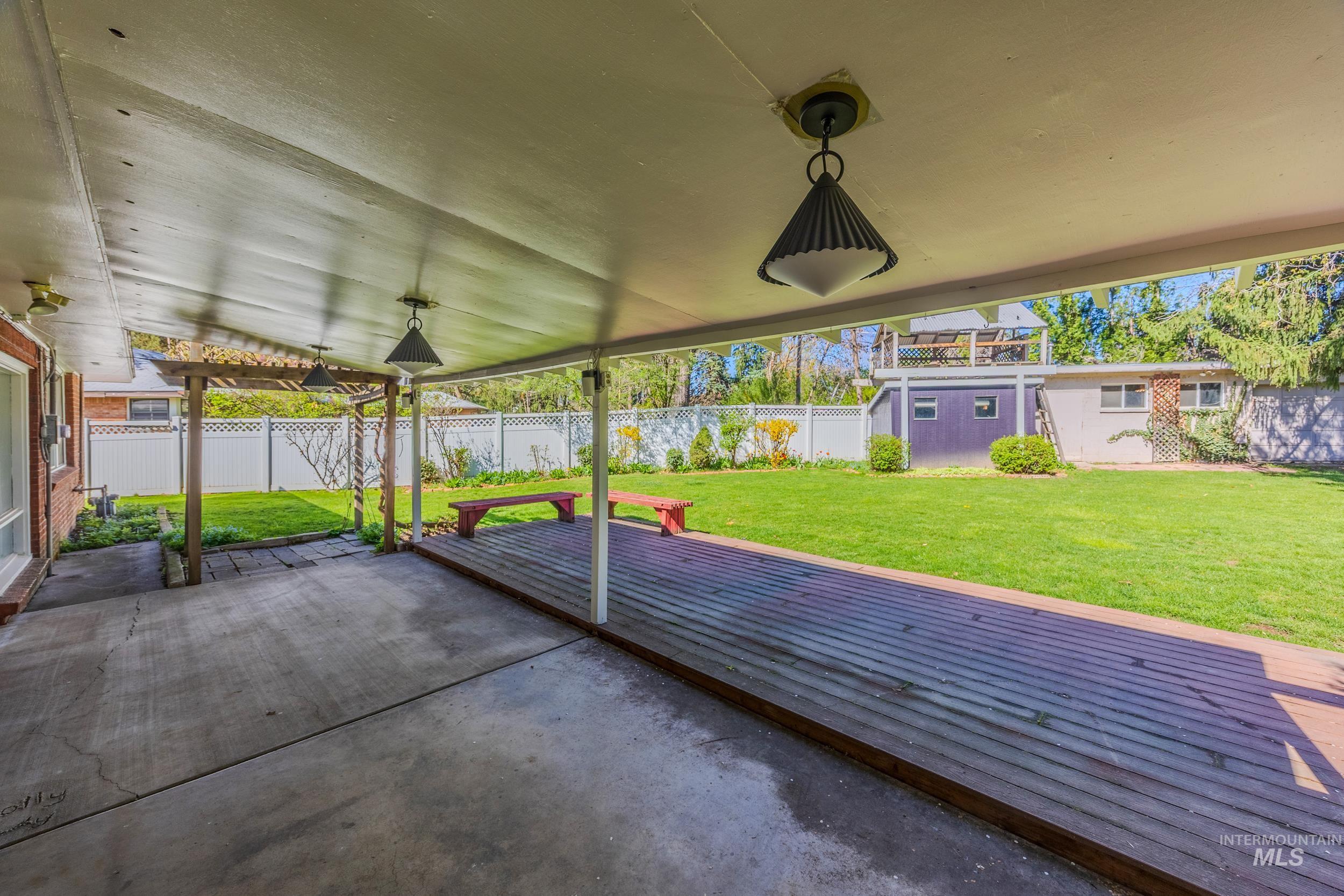 Fenced backyard featuring a patio area