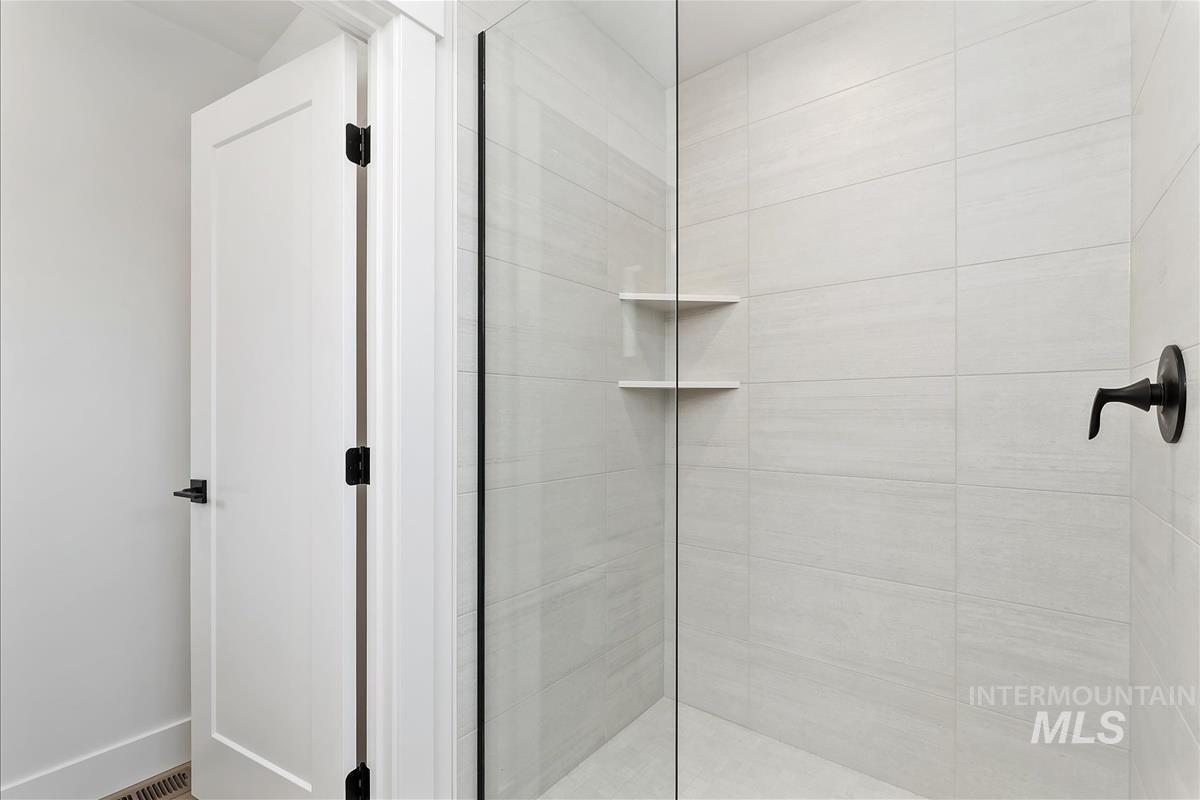 Bathroom with tiled shower