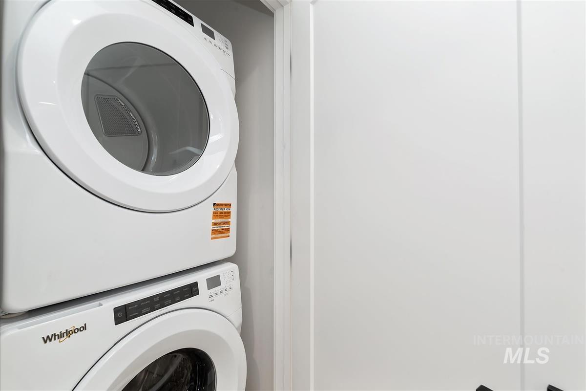 Washroom with estacked washer and dryer