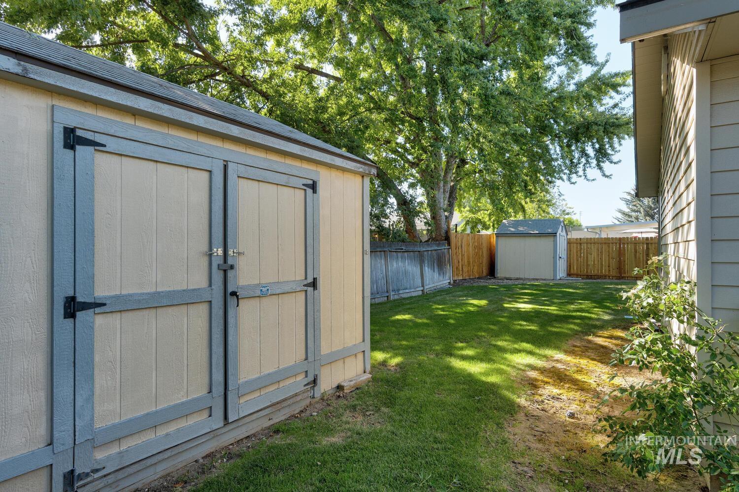 View of shed with a fenced backyard
