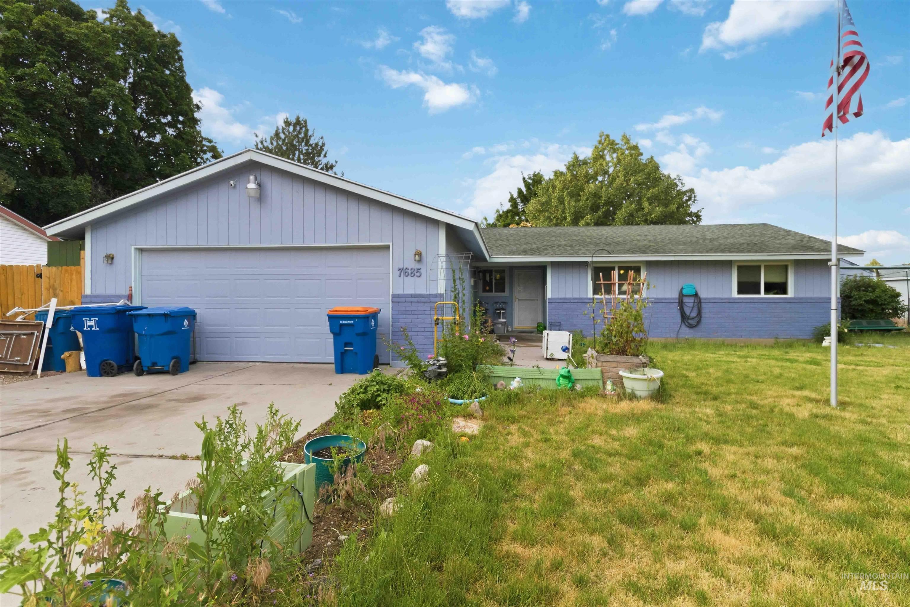 Ranch-style exterior with light blue and darker blue siding