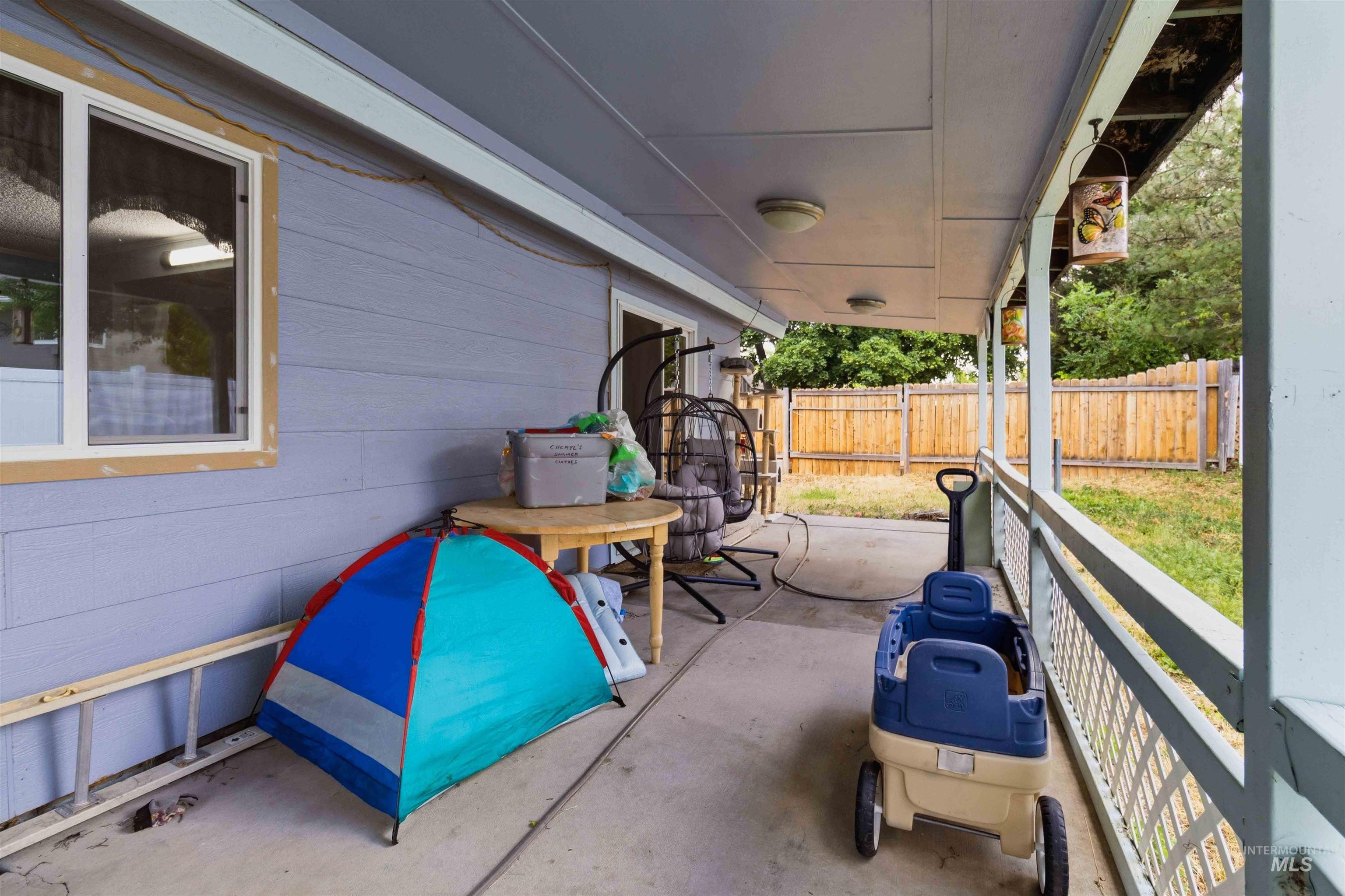 Covered patio featuring concrete flooring and exterior siding