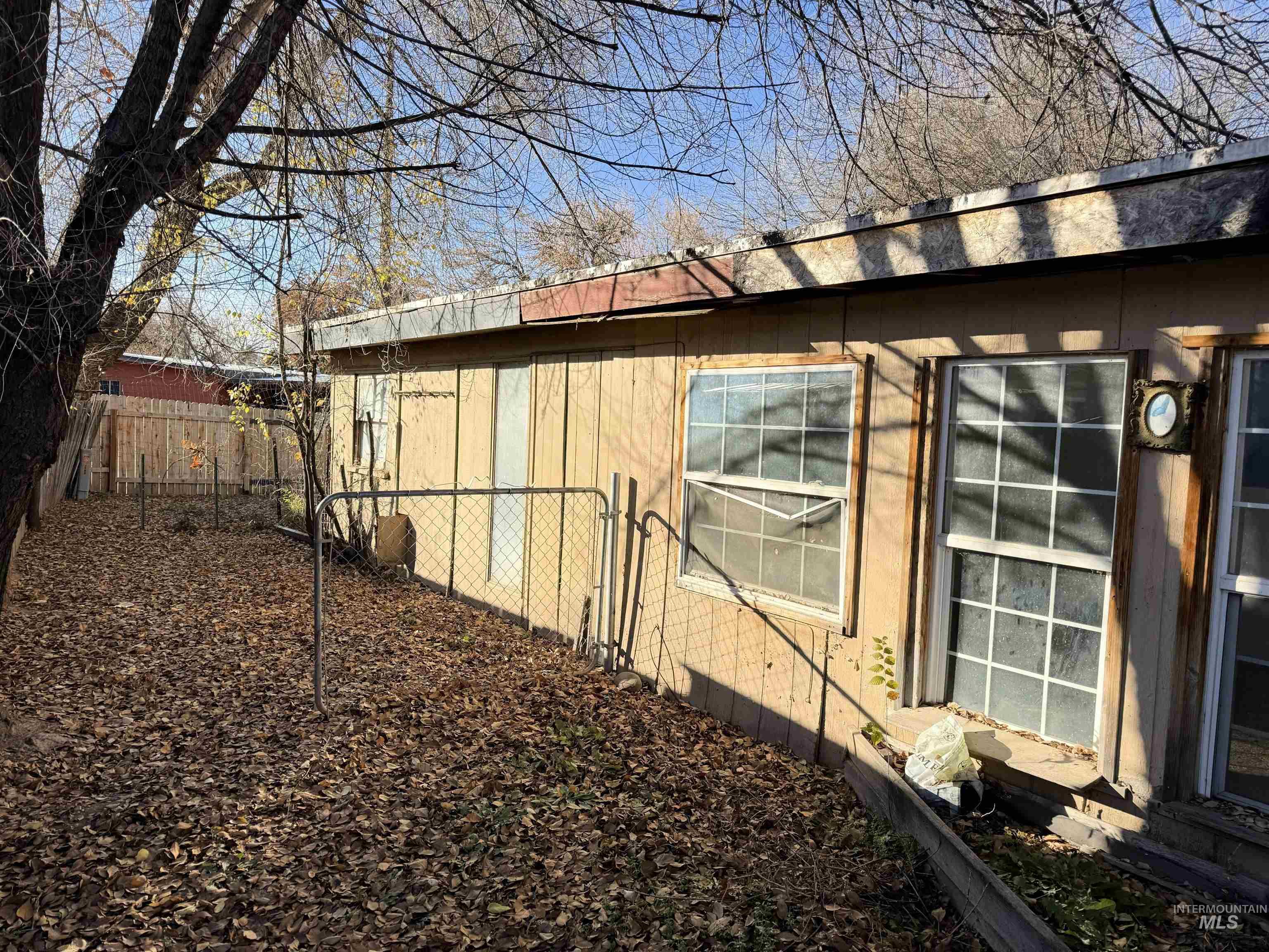 View of side of property with a metal roof