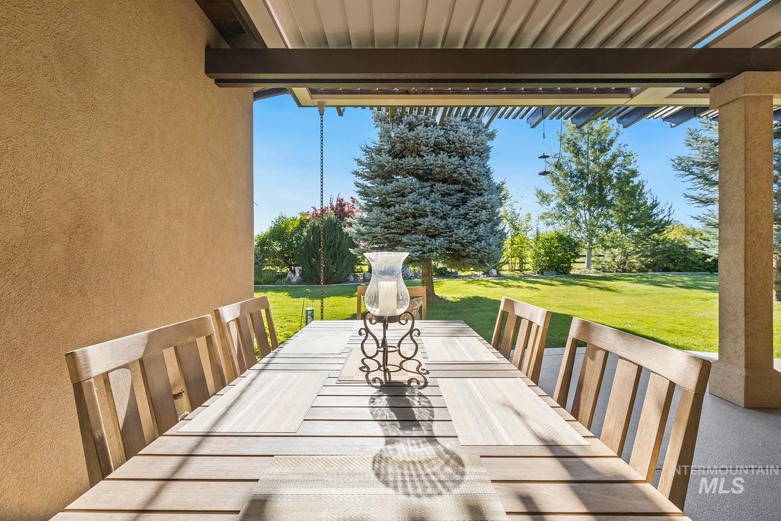 View of patio with a wooden deck