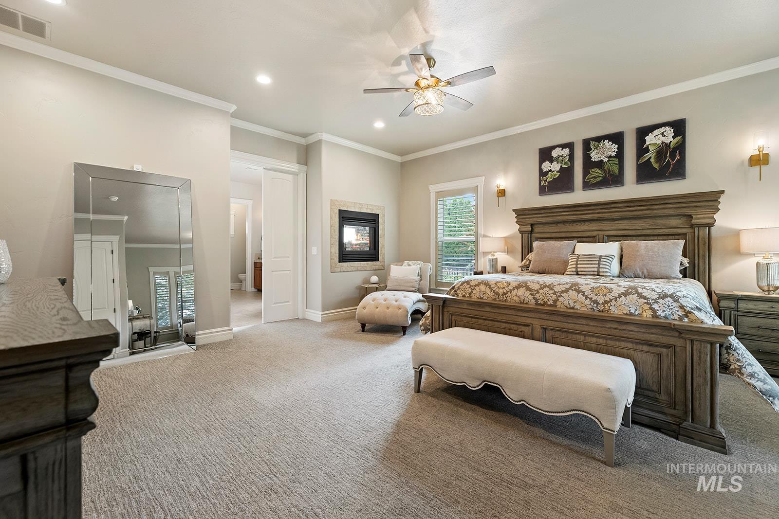 Bedroom with multiple windows, crown molding, carpet floors, recessed lighting, and a ceiling fan