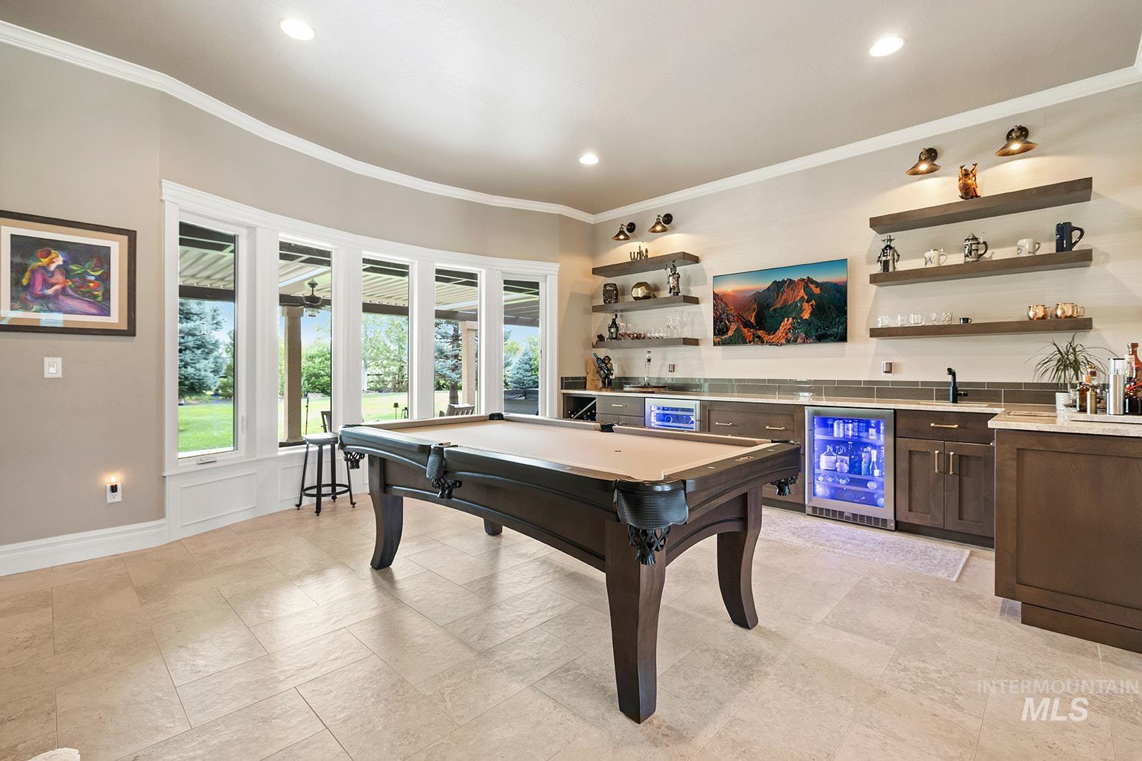 Recreation room featuring wet bar, wine cooler, ornamental molding, recessed lighting, and pool table