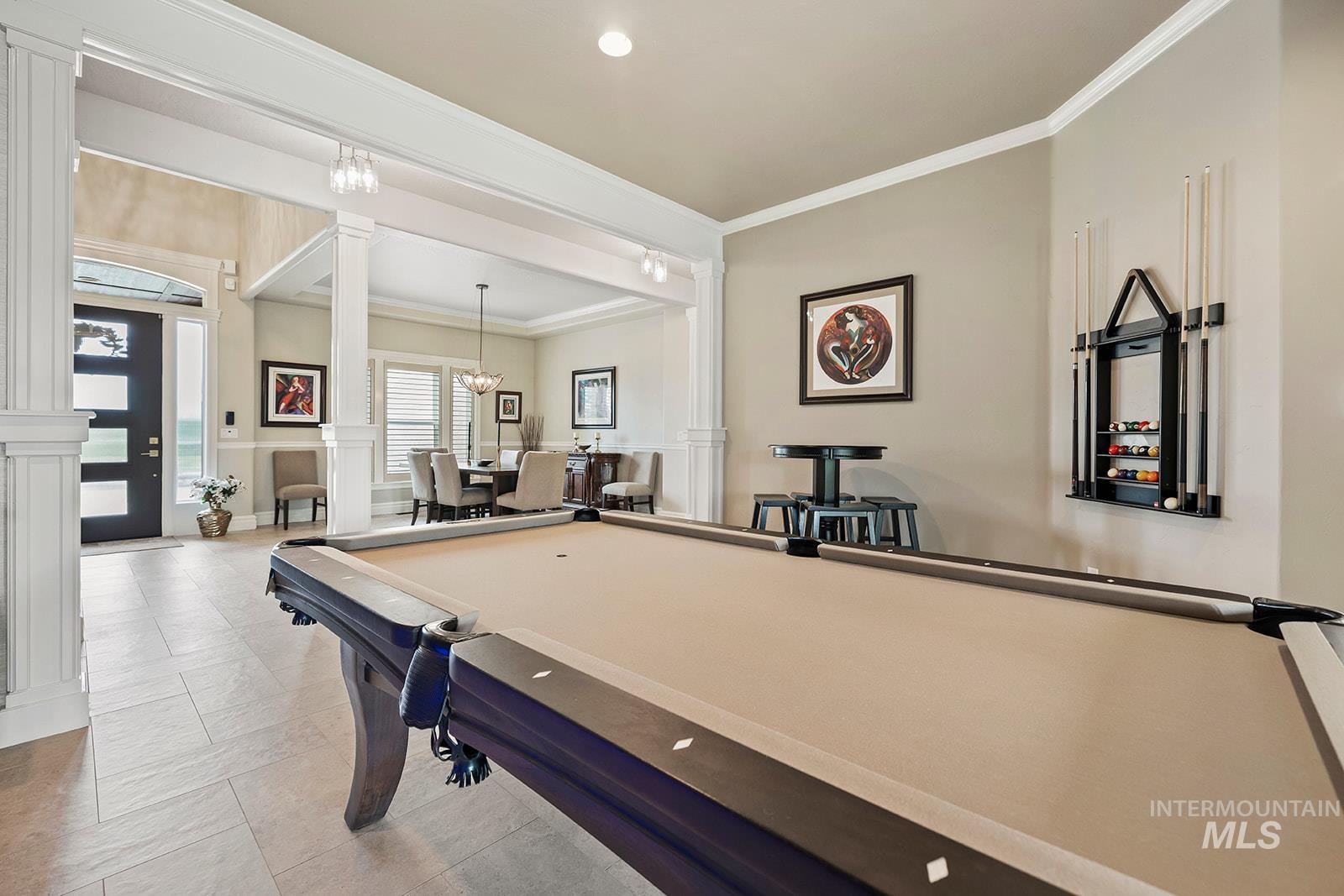 Recreation room with crown molding, billiards table, a chandelier, recessed lighting, and decorative columns