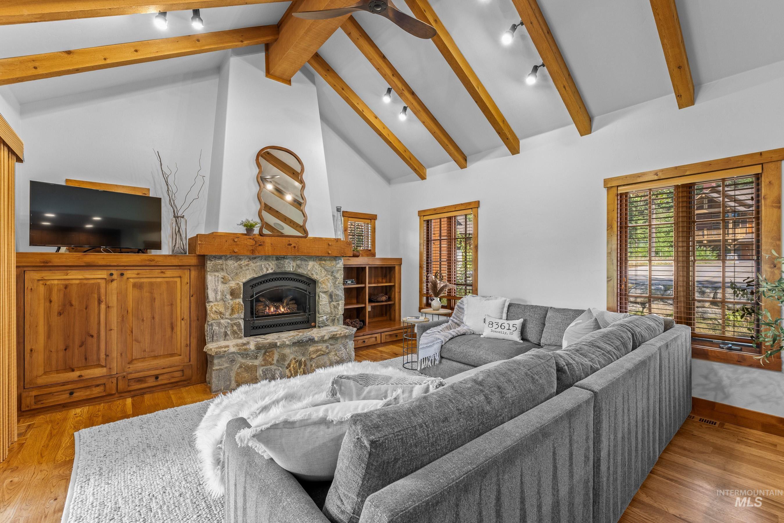 Living area featuring high vaulted ceiling