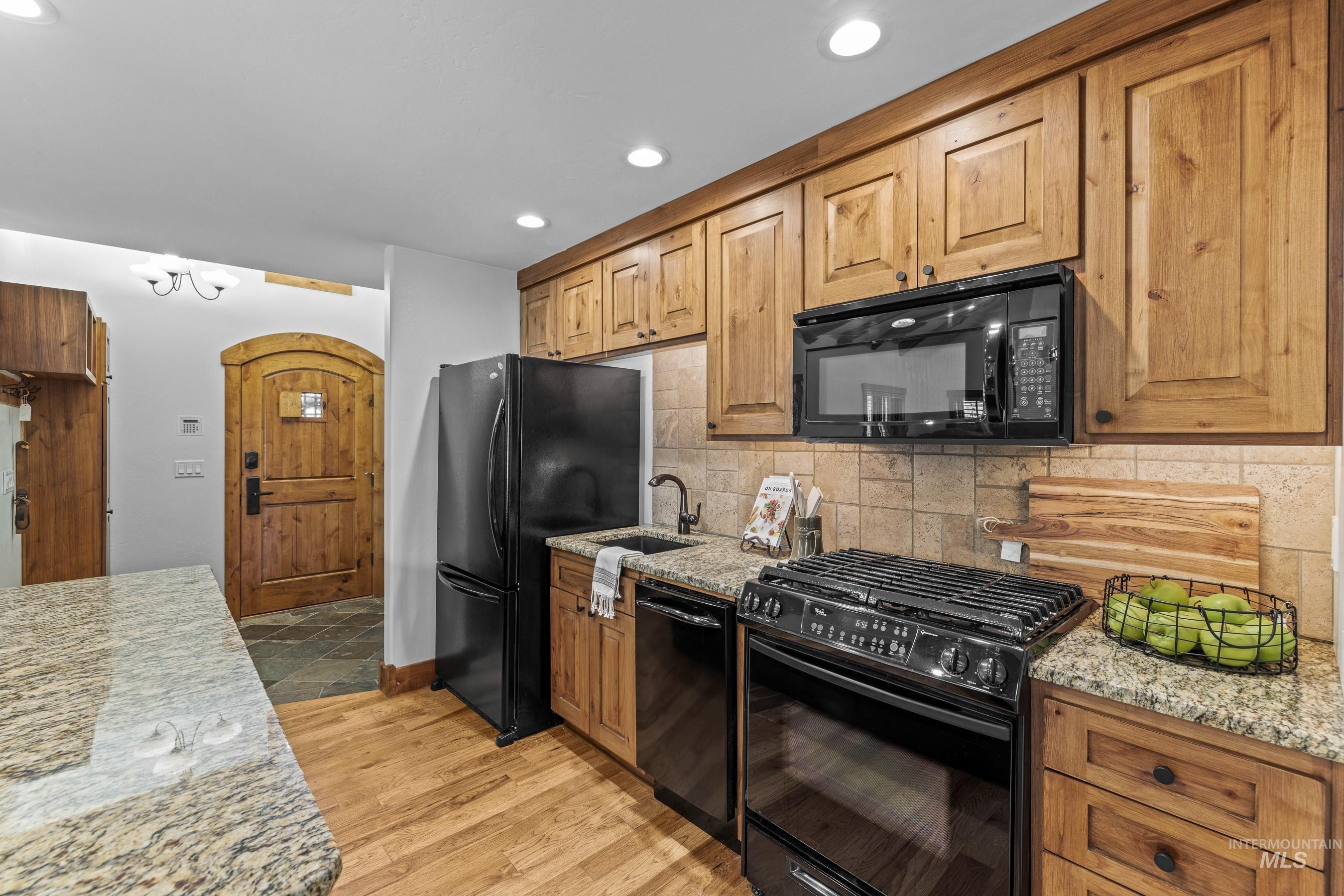 Kitchen with black appliances