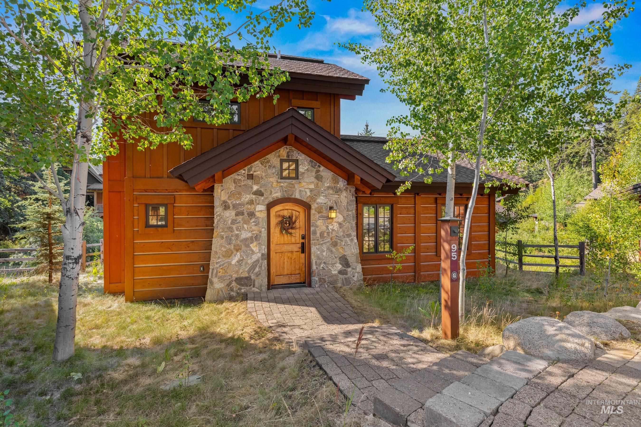 View of front of house with stone siding