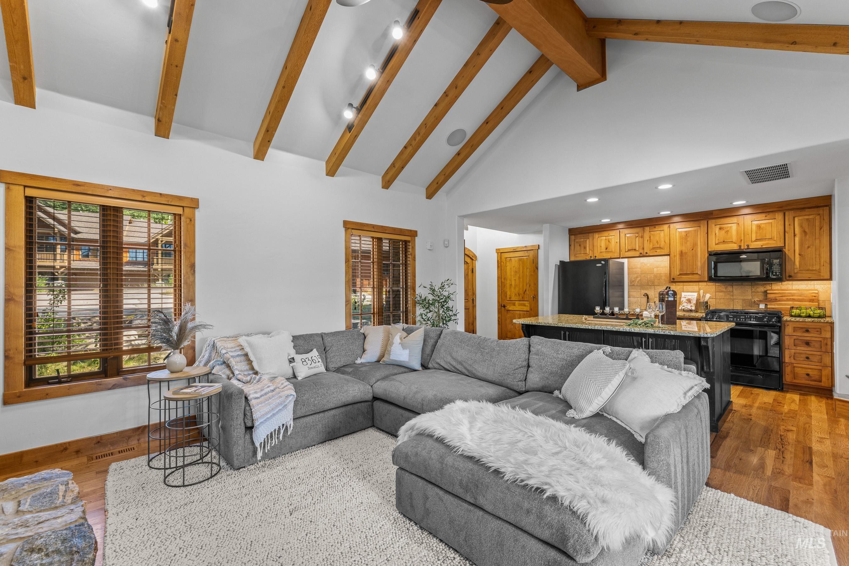 Living room with high vaulted ceiling