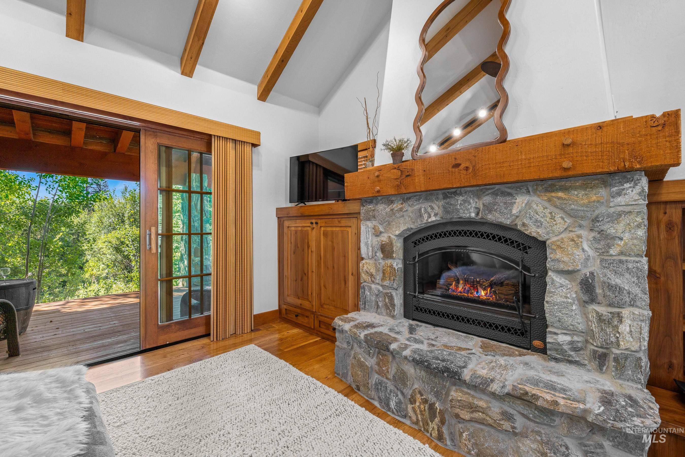Living area with a stone fireplace