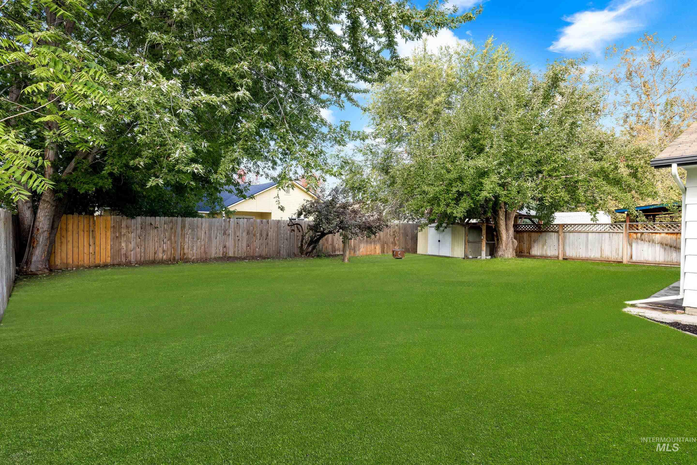 View of fenced backyard