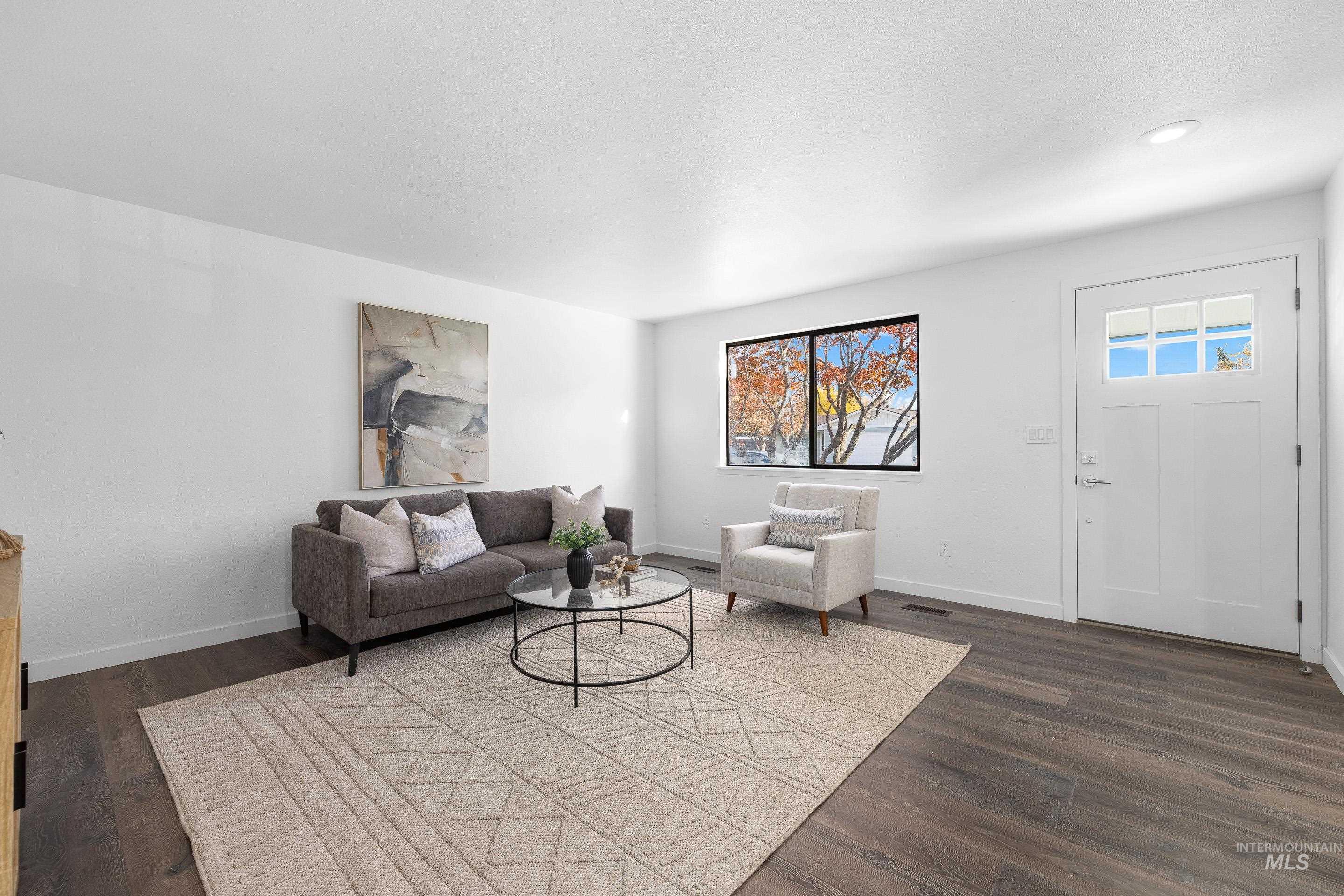 Living room featuring dark wood-style flooring