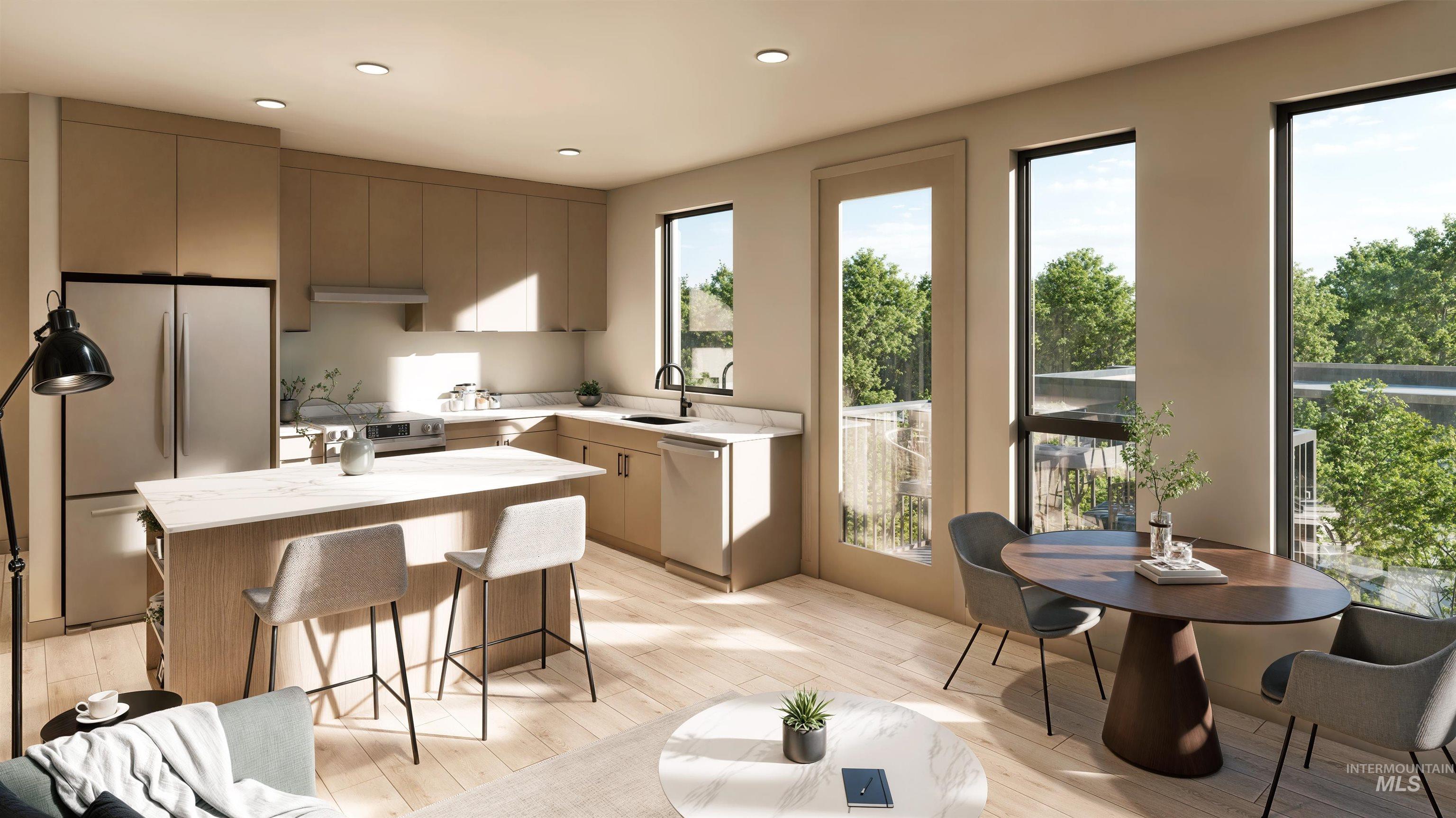 Kitchen featuring stainless steel appliances, a center island, recessed lighting, light wood-style flooring, and a kitchen bar