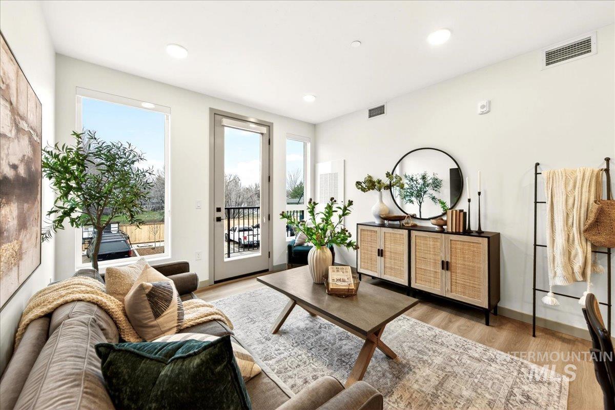Sitting room featuring light wood finished floors and recessed lighting