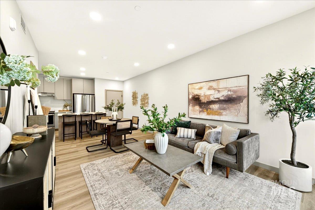 Living area featuring light wood-type flooring and recessed lighting