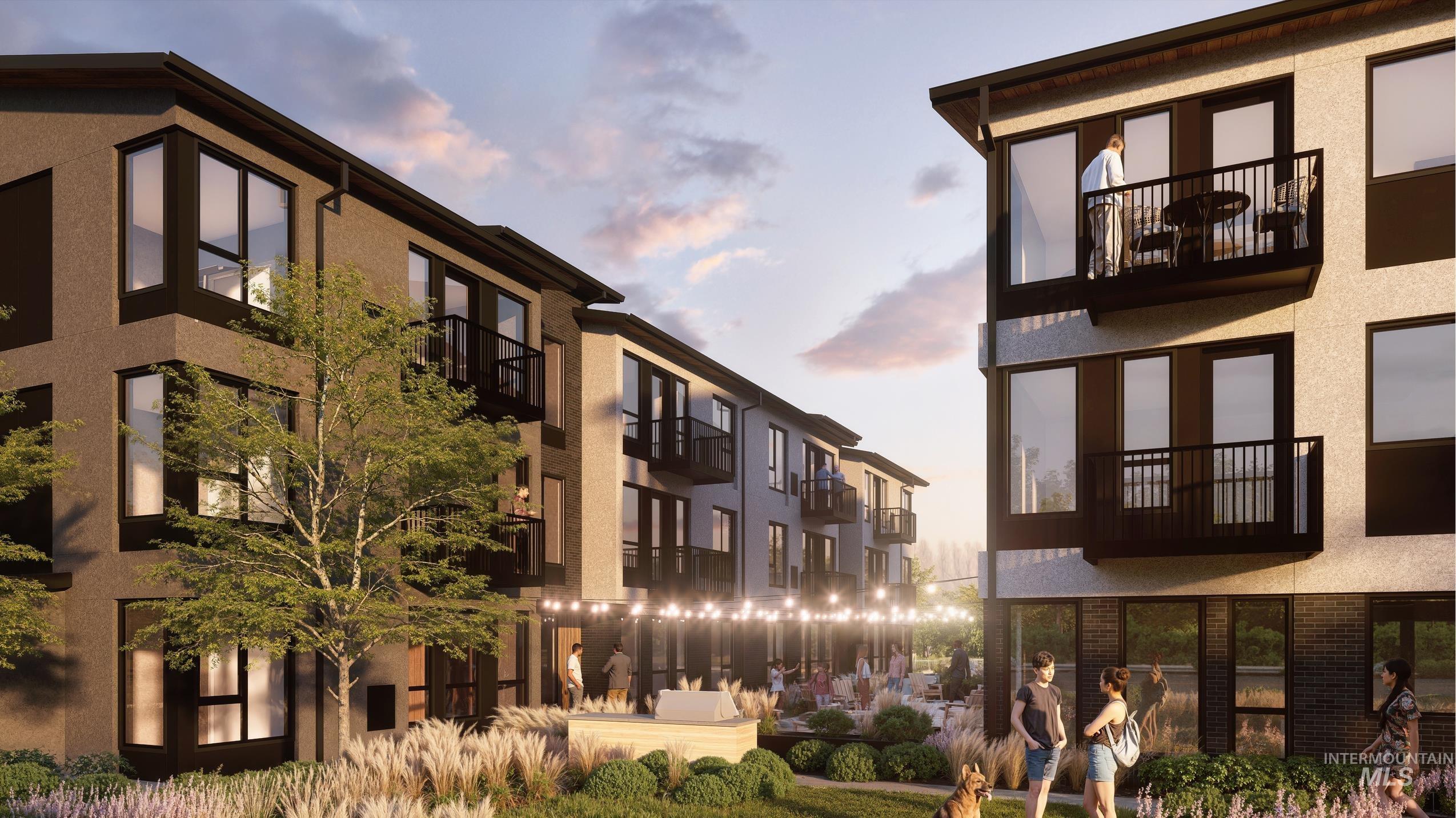 Property at dusk with a view of apartment building / complex