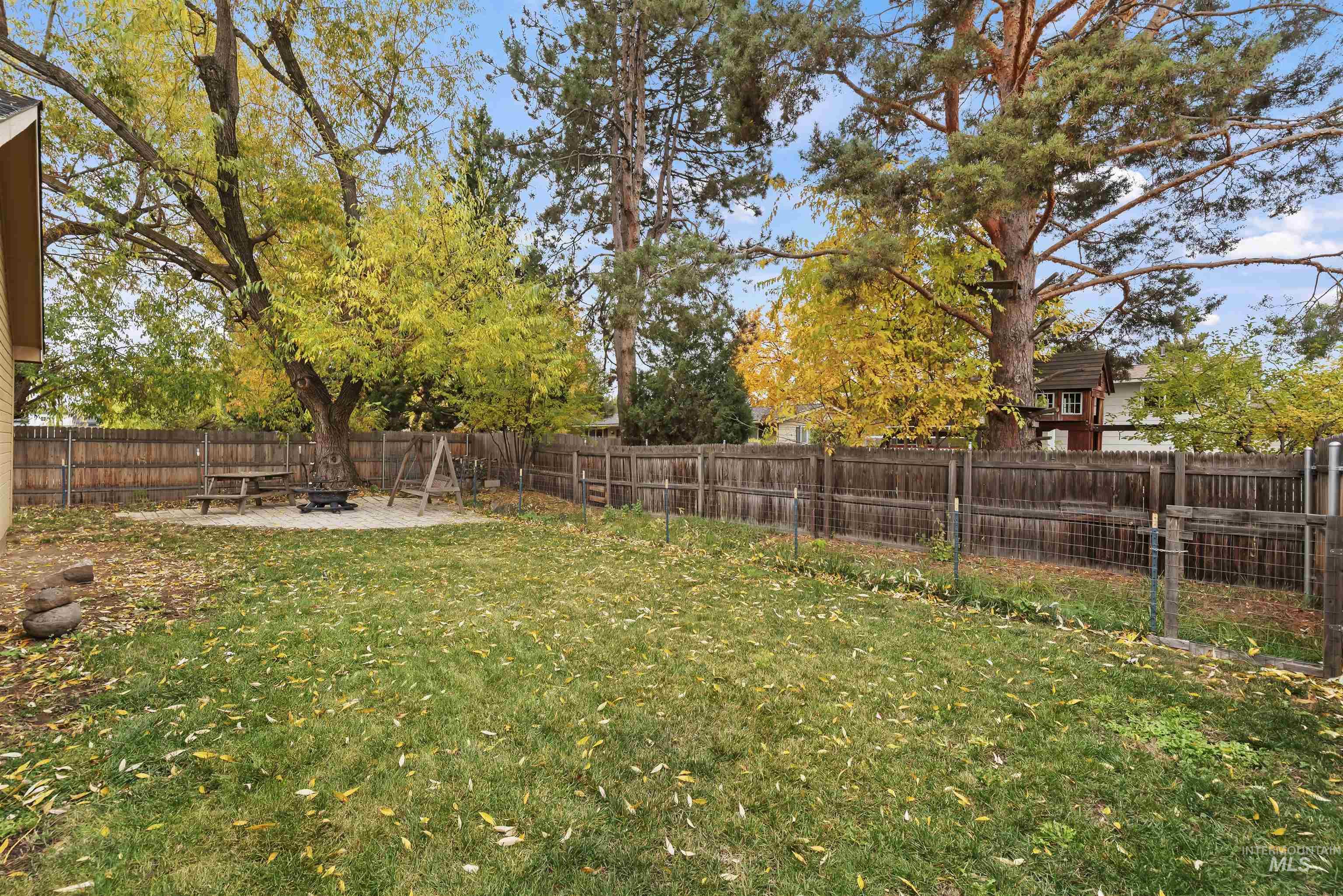 Fenced backyard featuring a patio area
