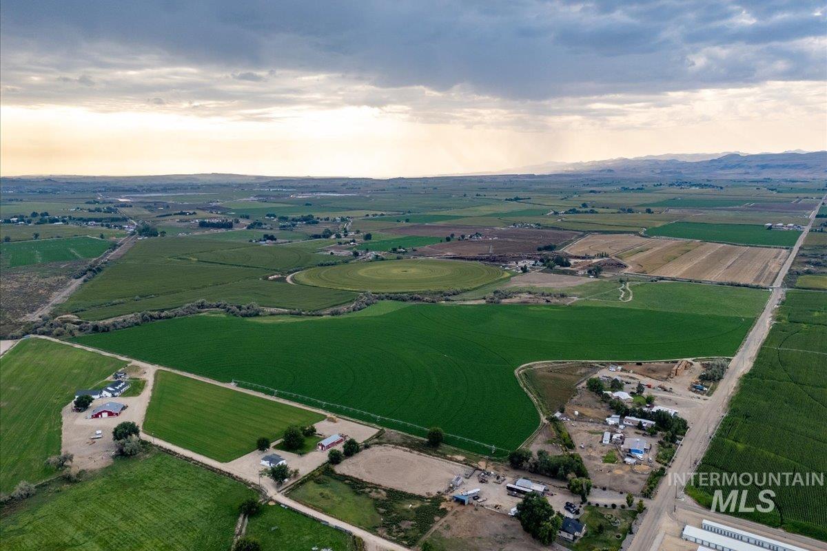 Aerial view of property's location with rural landscape and farmland
