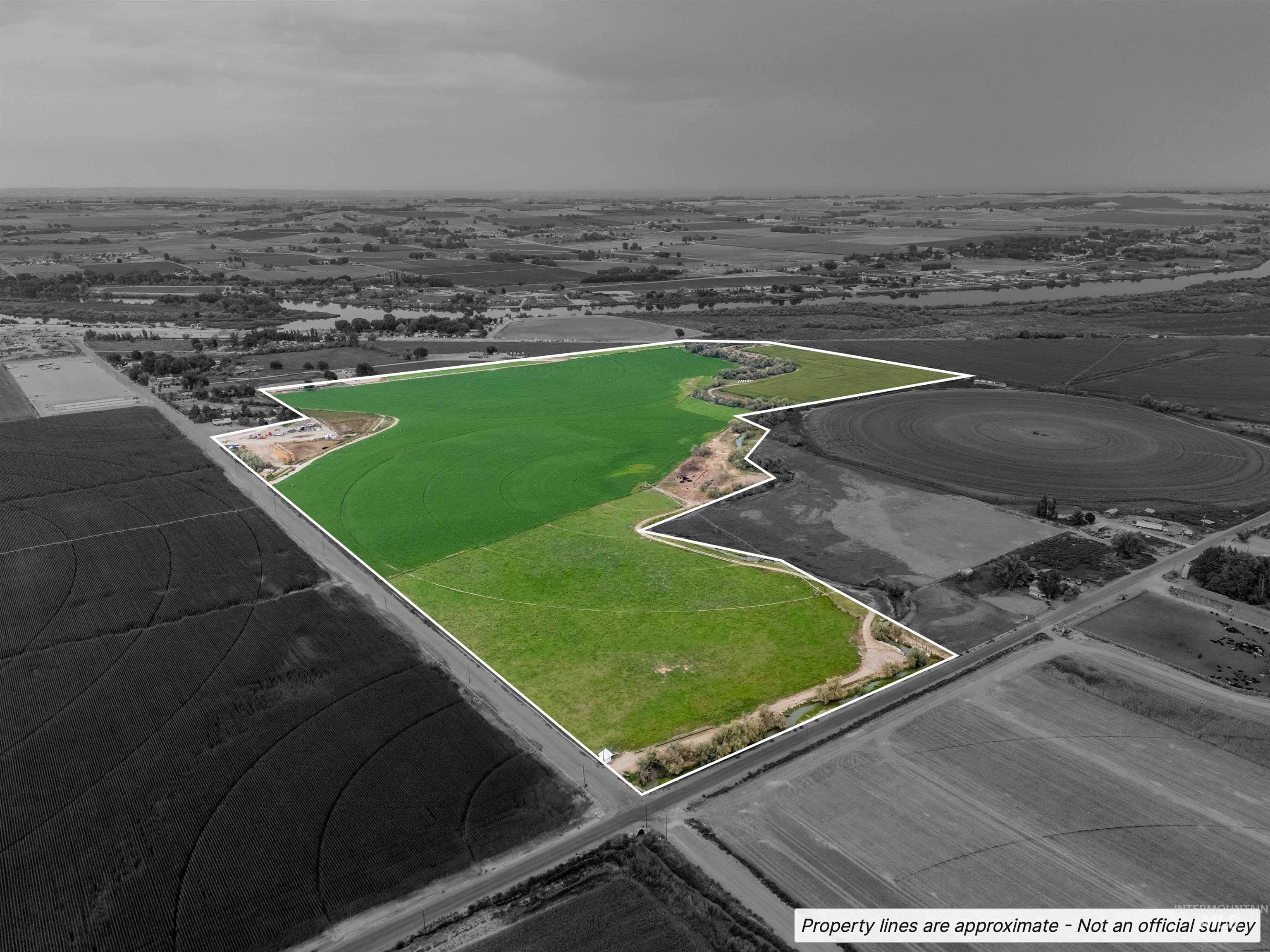 Aerial view of sparsely populated area with property boundaries highlighted