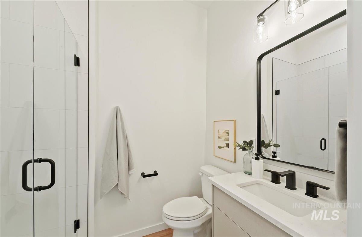 Full bathroom featuring vanity and a stall shower