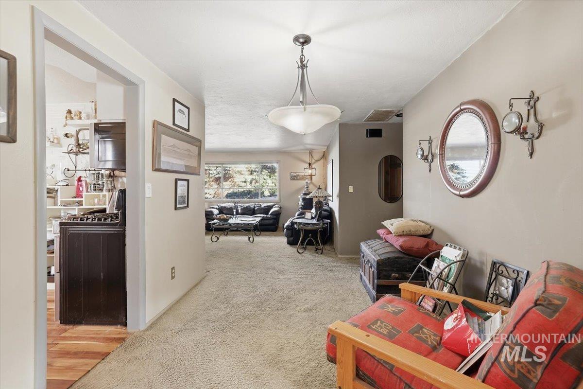 Corridor with light colored carpet