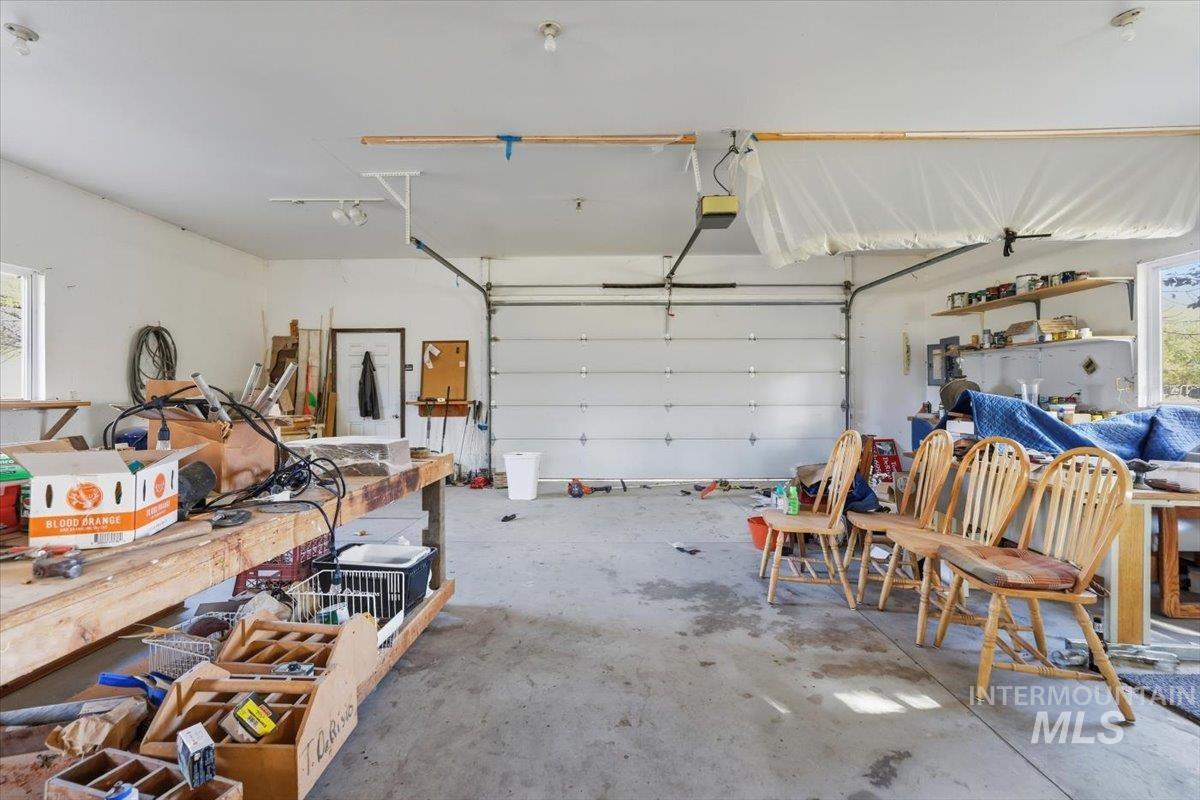 Garage featuring a garage door opener