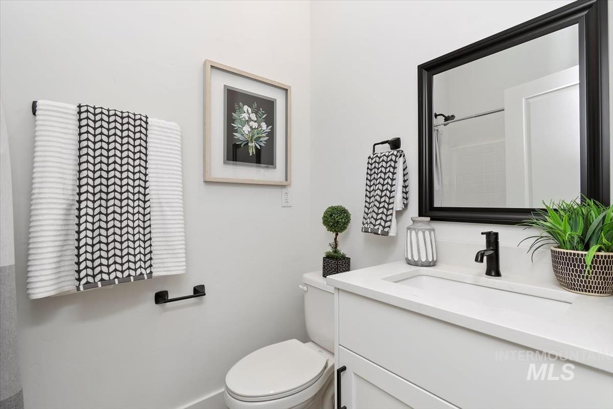 Full bath with vanity and a shower with curtain