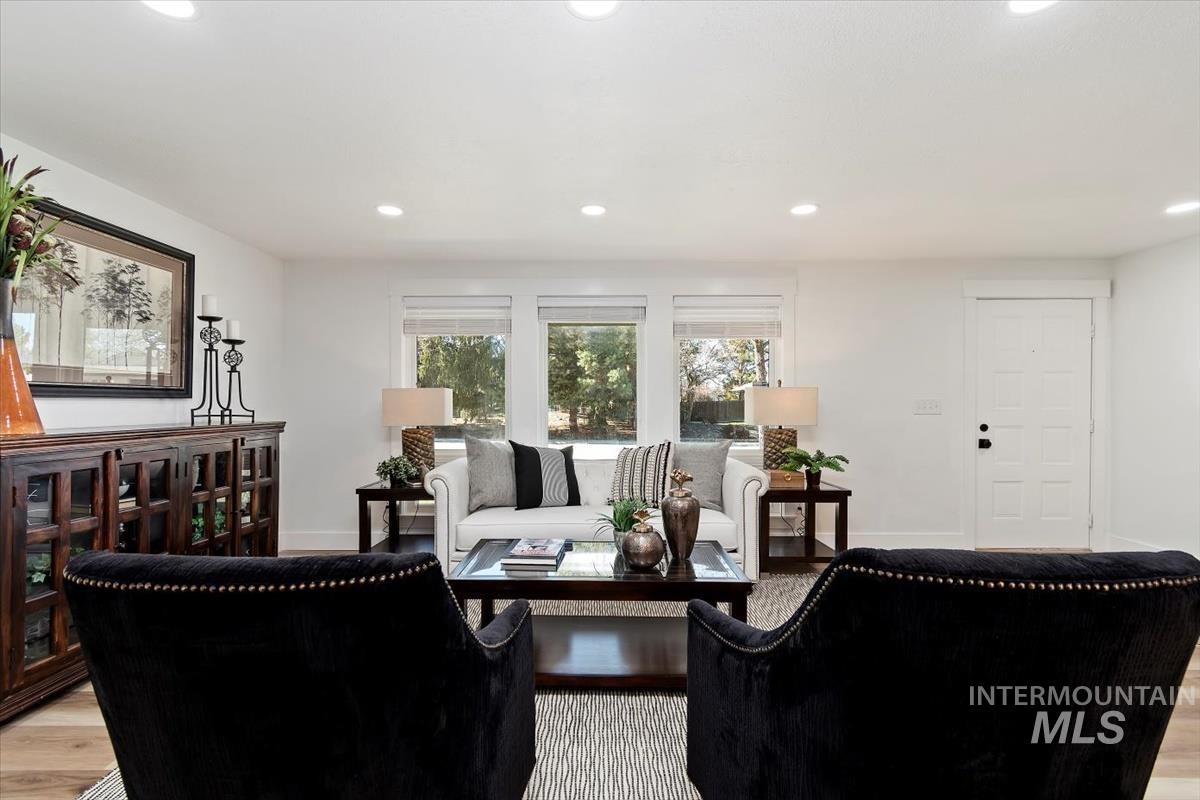 Living area featuring recessed lighting and light wood-type flooring