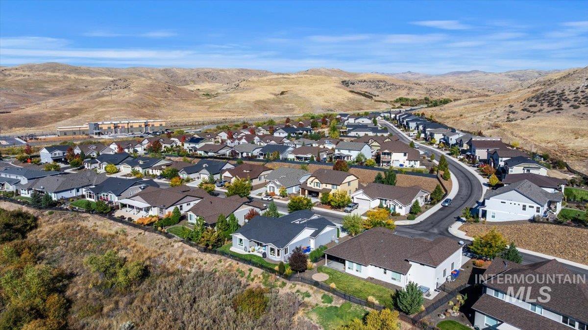 View of property location with a mountain backdrop and nearby suburban area
