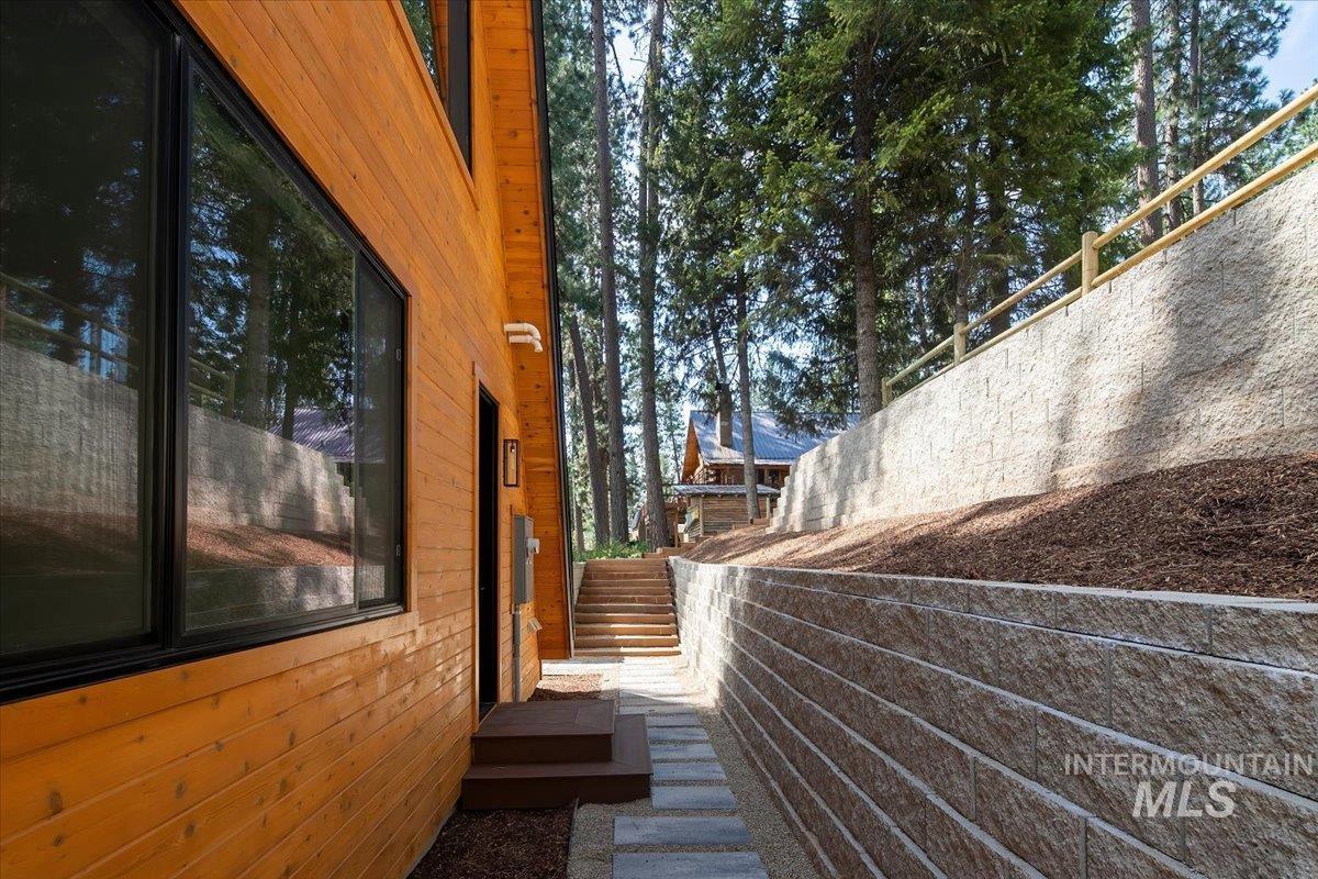 View of side of property with stairs