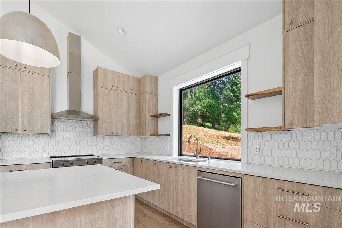 Kitchen with open shelves, light brown cabinets, modern cabinets, and lofted ceiling