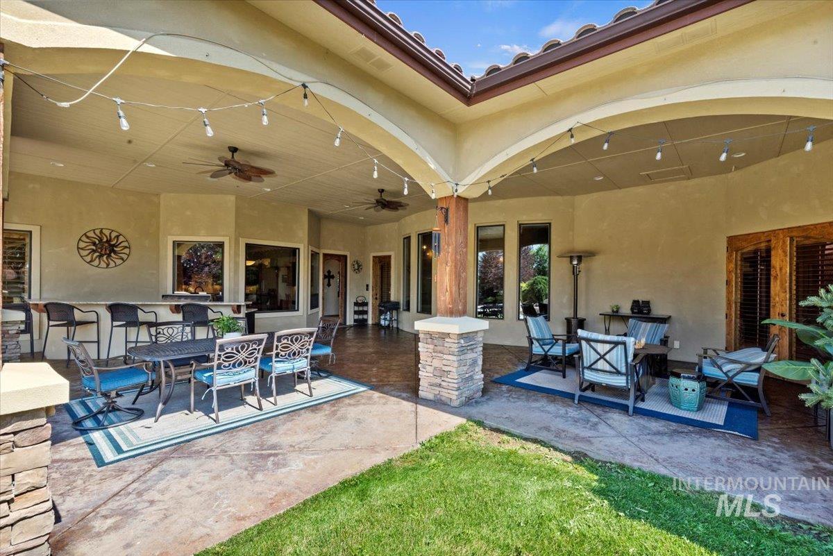 View of patio with ceiling fan