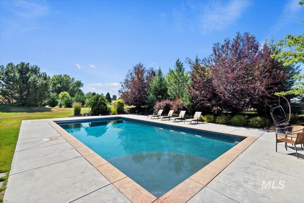 Outdoor pool featuring a patio