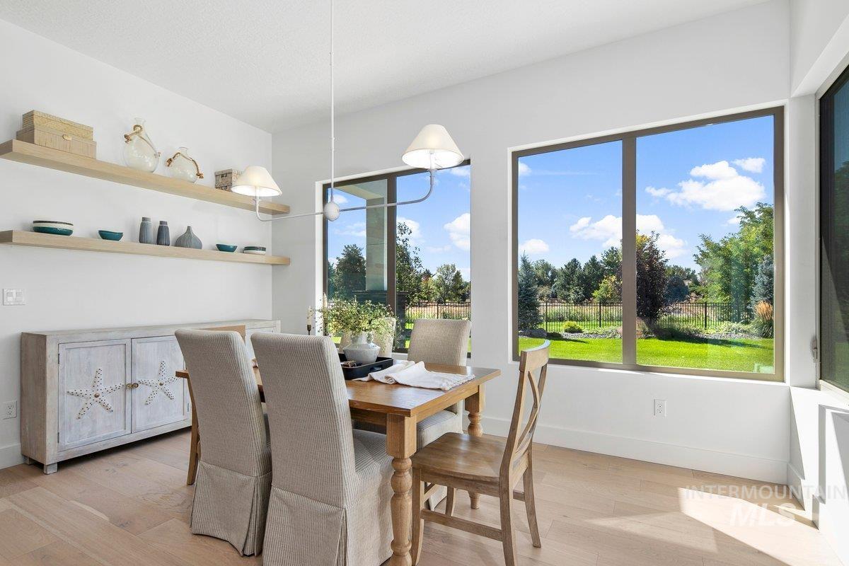 Dining space with light wood finished floors and baseboards