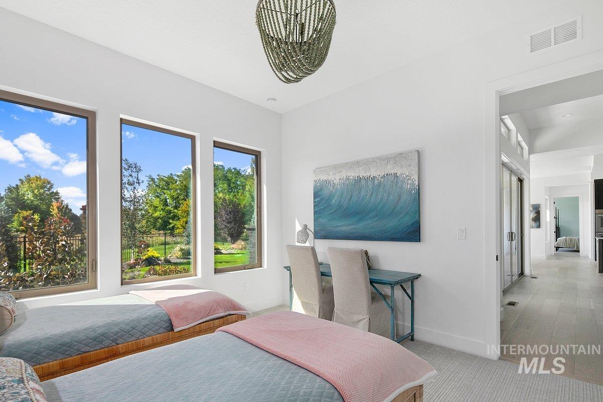 Carpeted bedroom featuring baseboards